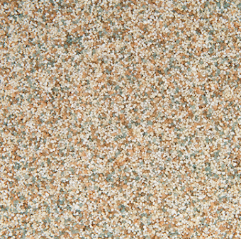 Close-up of a speckled surface with tan, light green, and white particles.