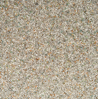 Close-up of a speckled, textured surface; shades of beige, gray, and flecks of other colors.