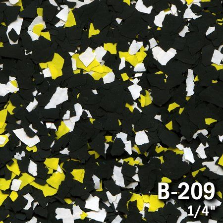 Black, yellow, and white decorative floor chips in a random pattern; 