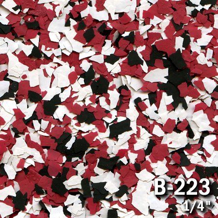 Red, black, and white decorative floor flakes. The pattern has a quarter-inch size.