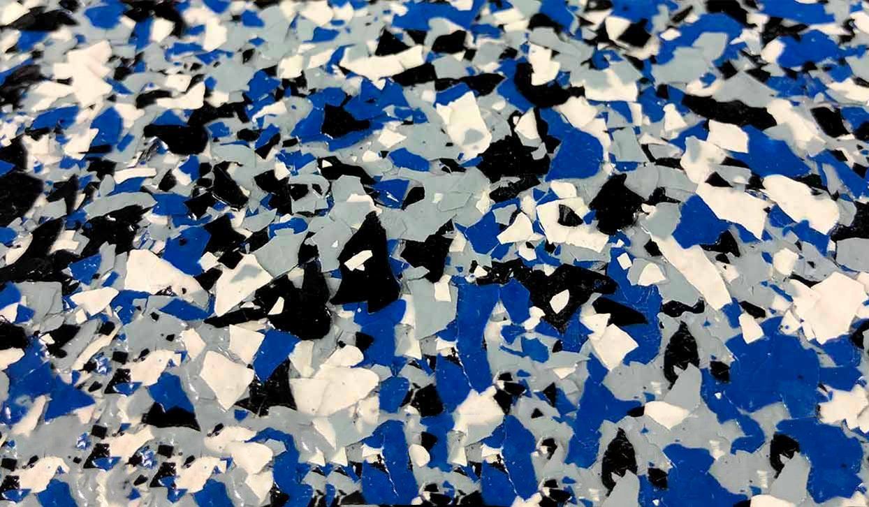 Blue, white, gray, and black speckled epoxy floor coating.