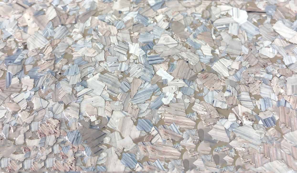 Blue, white, and tan flake epoxy flooring.