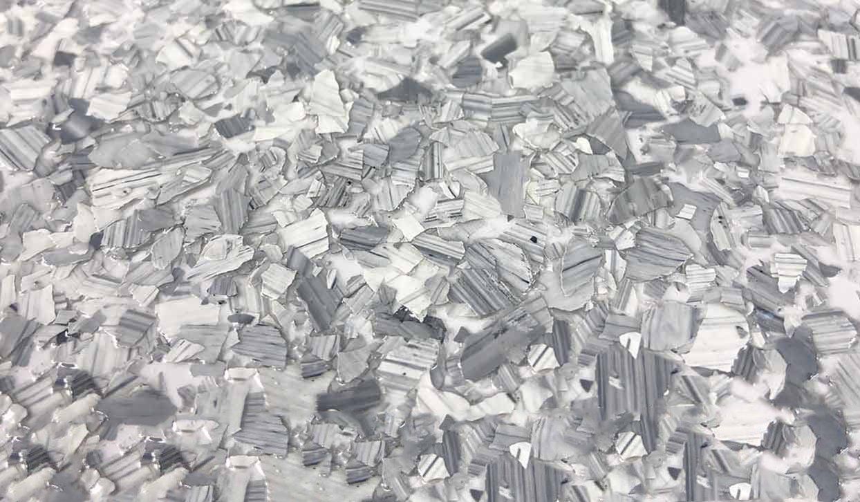 Gray and white speckled floor coating.