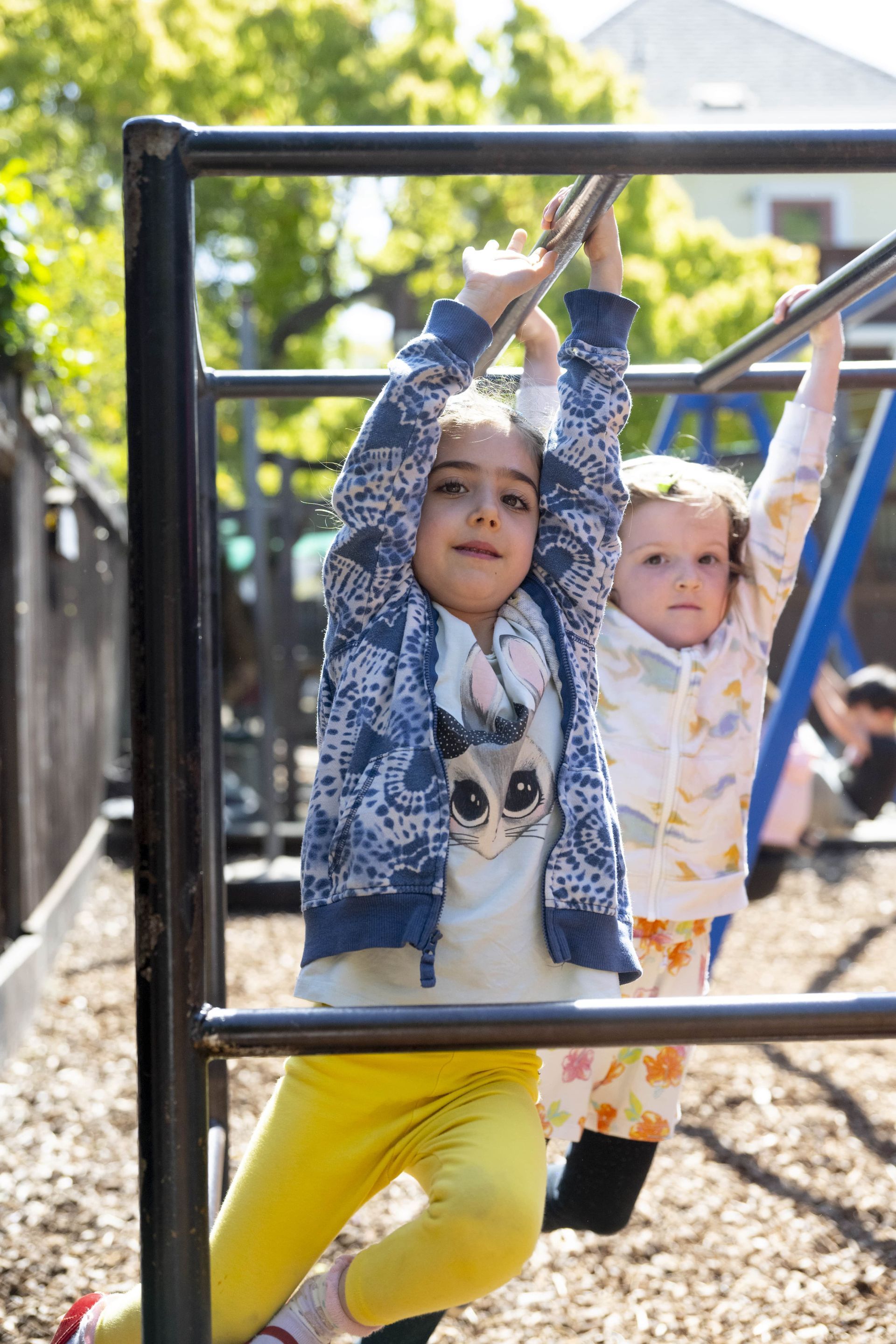 Montessori children are playing on a playground.