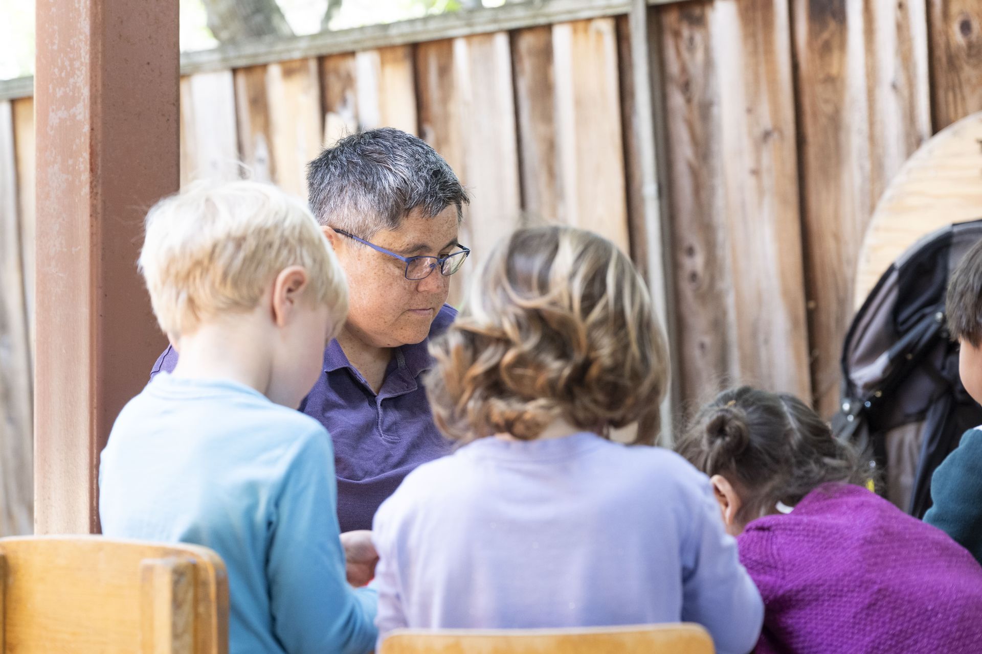 Students and guide in a Montessori classroom