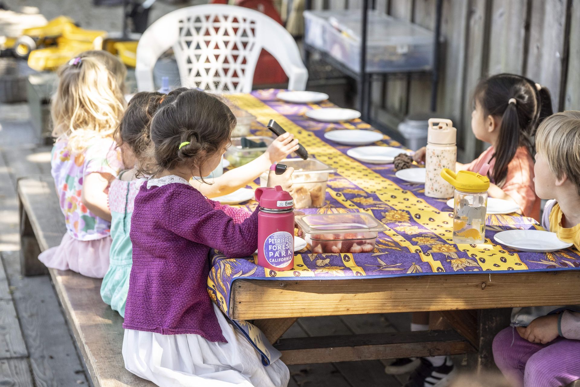 Children working together with the Montessori Pink Tower