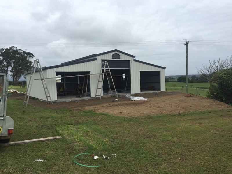 A Large White Barn Is Being Built In A Grassy Field – South Kempsey NSW - Fair Dinkum Builds Macleay Valley Sheds