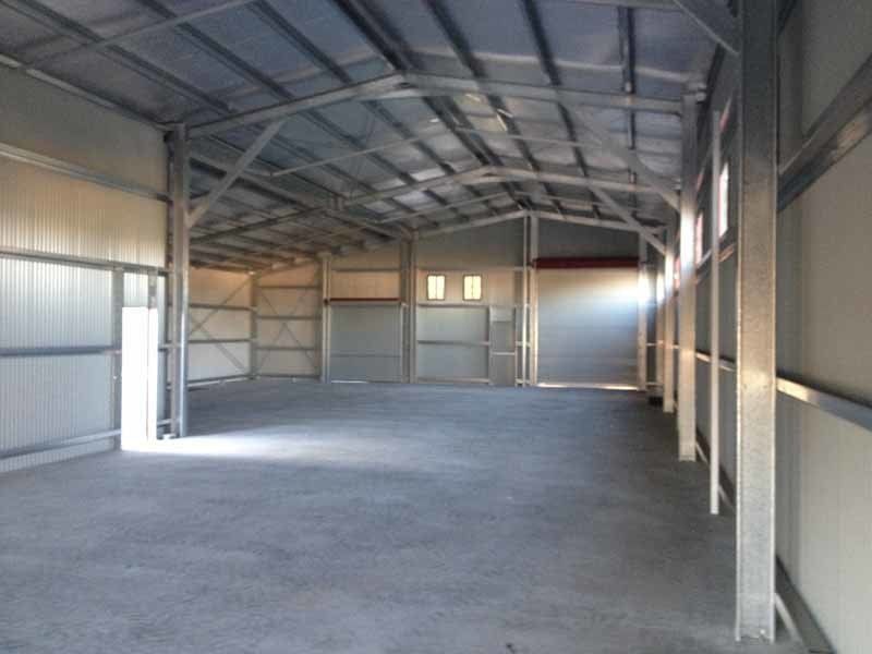 A Large Empty Warehouse With A Concrete Floor – South Kempsey NSW - Fair Dinkum Builds Macleay Valley Sheds