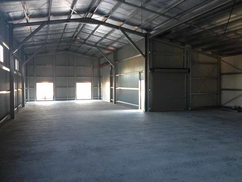 A Large Empty Warehouse With Concrete Floors And A Metal Roof – South Kempsey NSW - Fair Dinkum Builds Macleay Valley Sheds