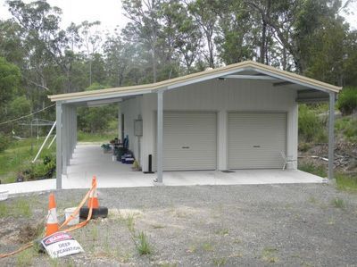 A White Garage With Two Garage Doors And A Canopy – South Kempsey NSW - Fair Dinkum Builds Macleay Valley Sheds