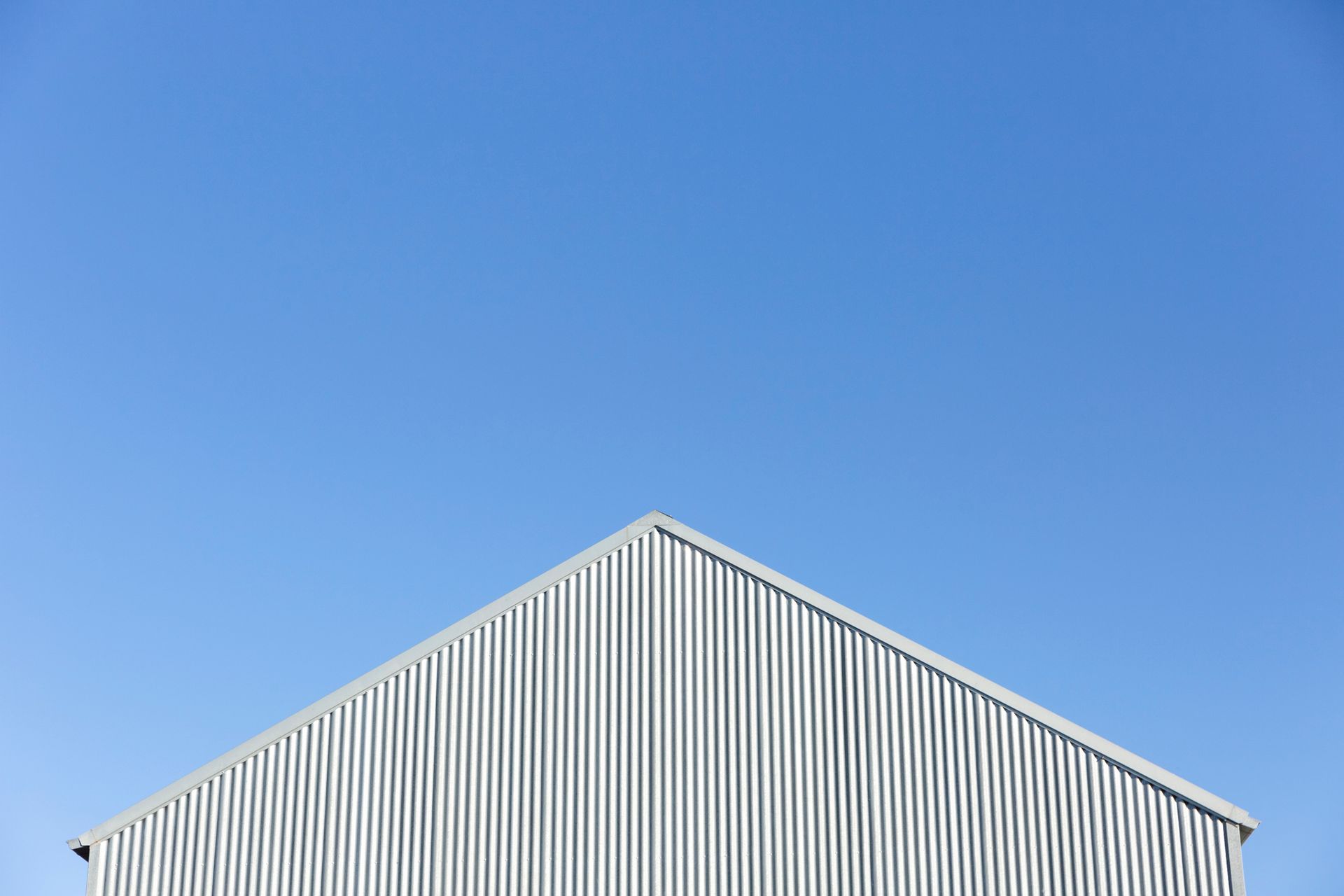 Image showcasing a custom shed with top corrugated iron roof in excellent condition.