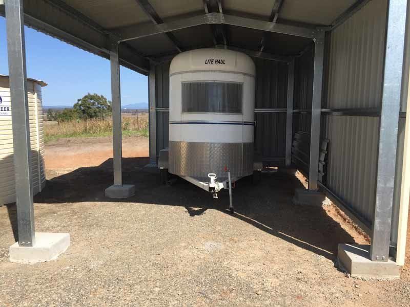 A Trailer Is Parked Under A Shed – South Kempsey NSW - Fair Dinkum Builds Macleay Valley Sheds