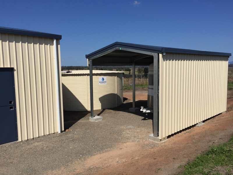 A Shed With A Roof Is Sitting Next To A Building – South Kempsey NSW - Fair Dinkum Builds Macleay Valley Sheds