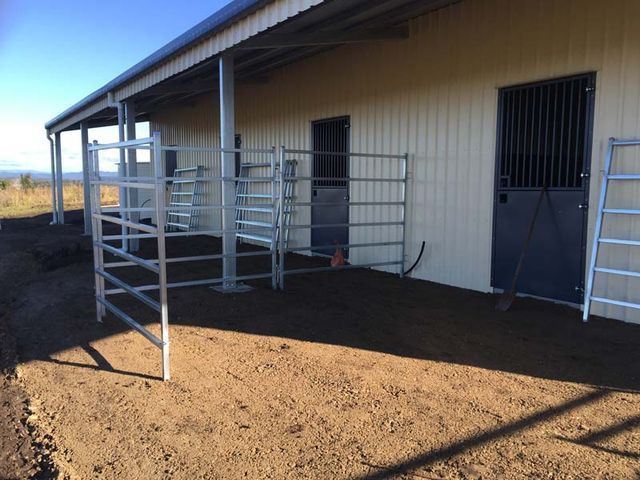 A Building With A Covered Porch And A Fence In Front Of It – South Kempsey NSW - Fair Dinkum Builds Macleay Valley Sheds