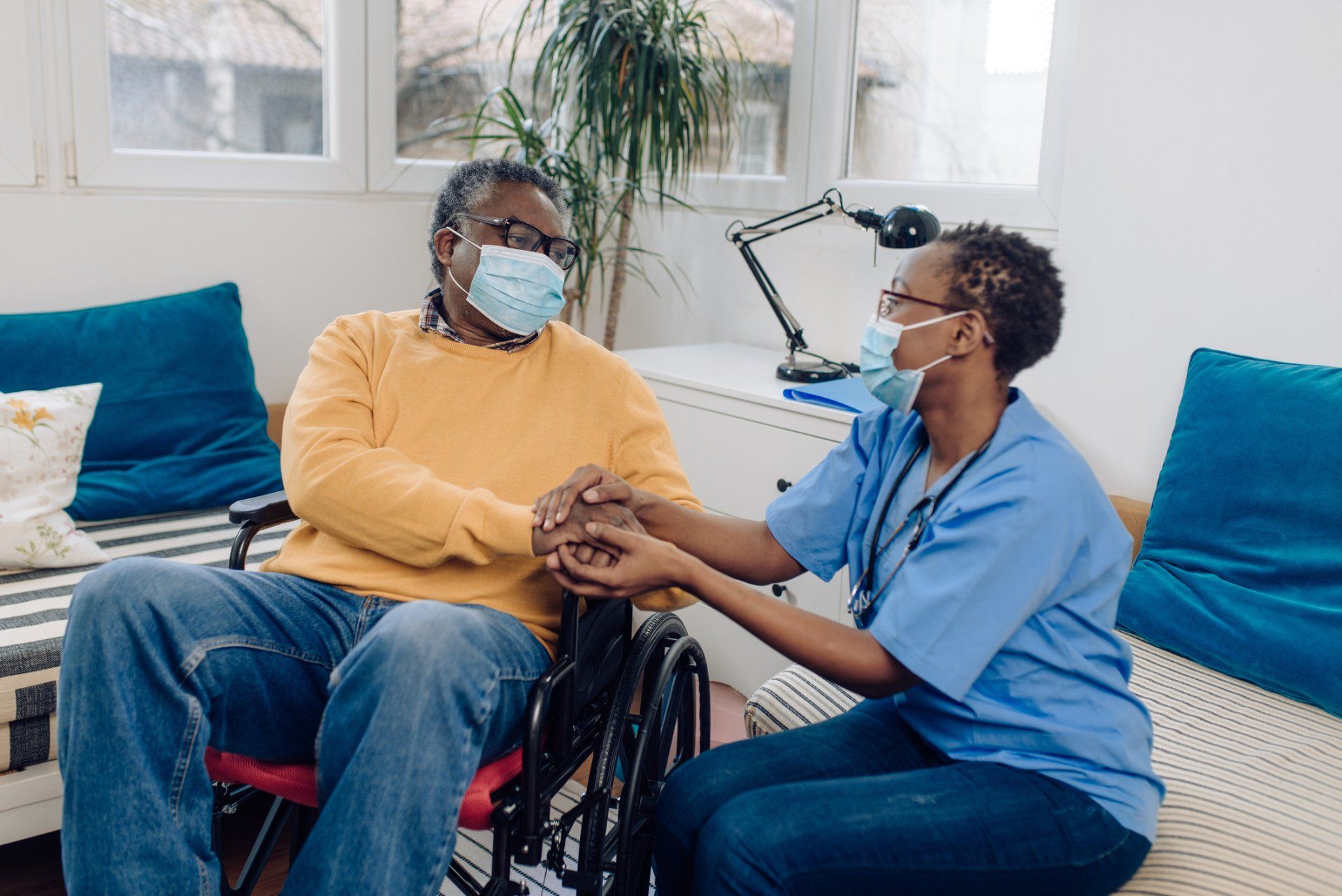 Caregiver and Senior Holding Hands — Charlotte, NC — United Home Care & Health Solutions, Inc. Caregiver and Senior Holding Hands — Charlotte, NC — United Home Care and Health Solutions, Inc.