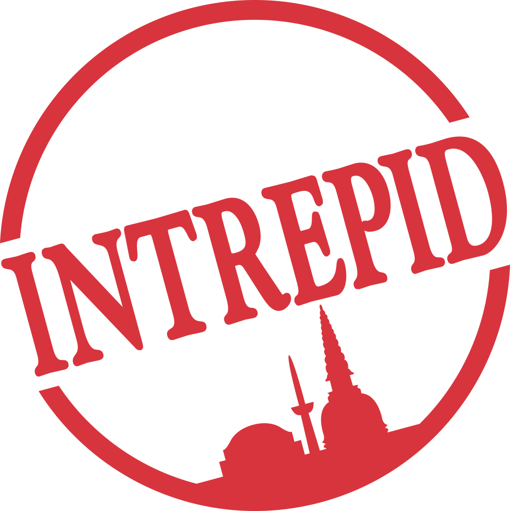 Red INTREPID logo in a circular stamp with a city skyline silhouette