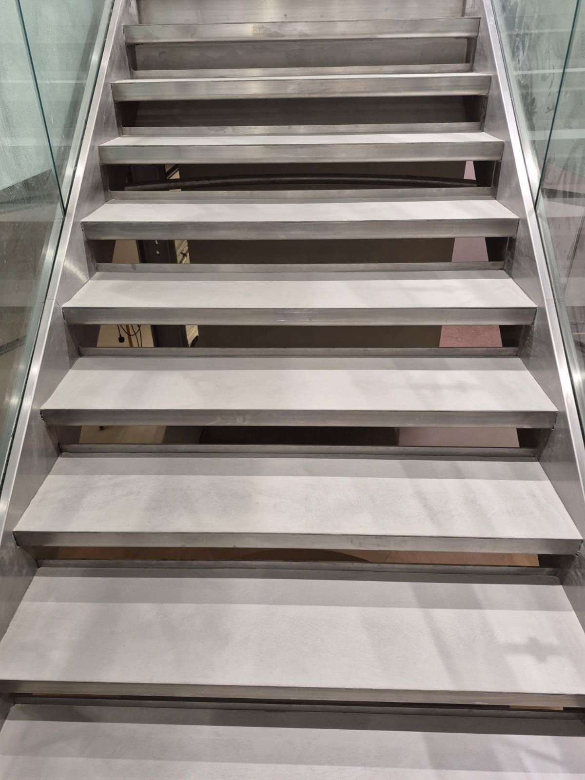 Seamless microcement flooring and staircase finish in a commercial property