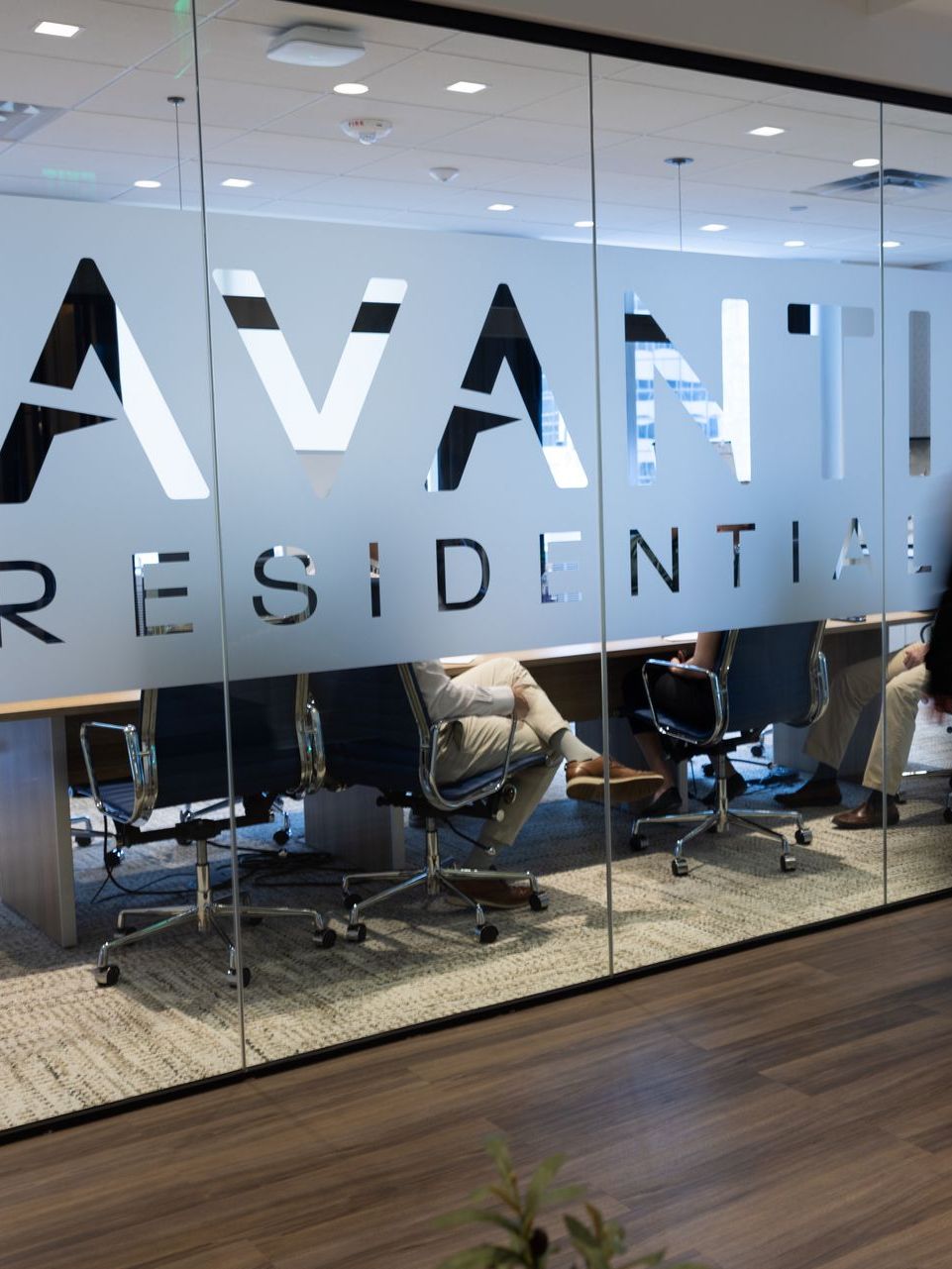 A glass wall with the word avant residential on it