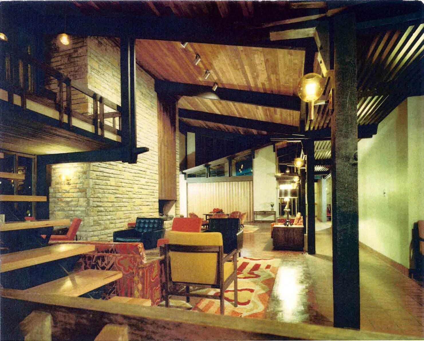 A living room with a lot of furniture and a fireplace