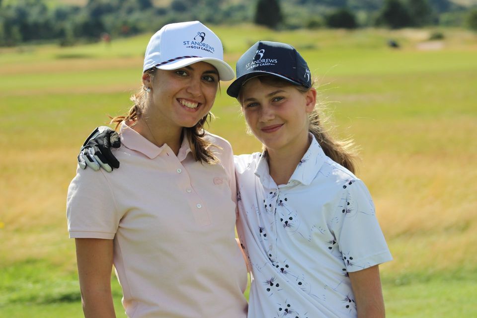 Smiling girl golfers