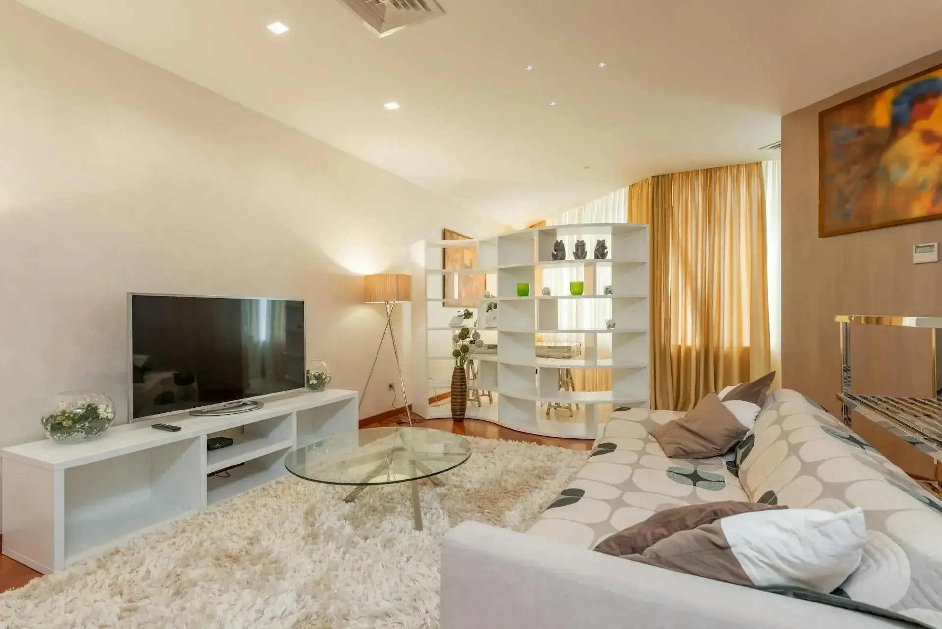 A living room with a couch and a flat screen tv