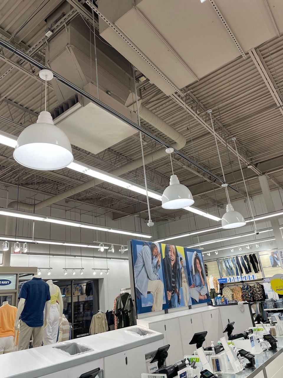 A store with a lot of lights hanging from the ceiling