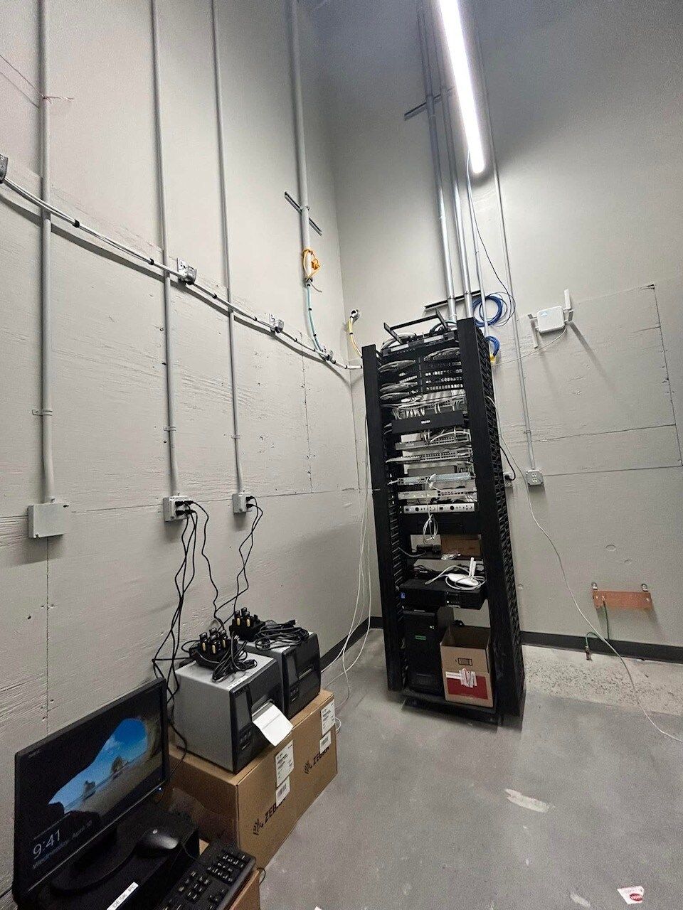 A room with a lot of computer equipment in it