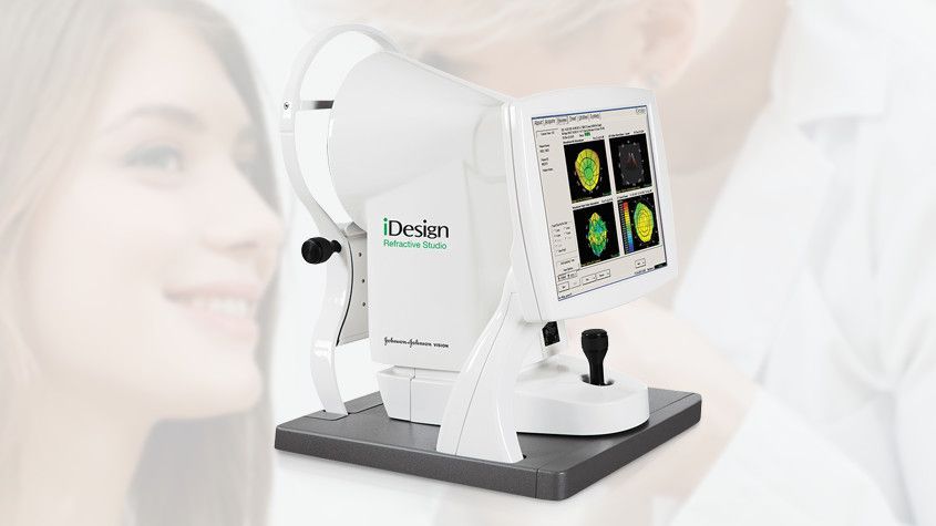 White dental scanning device with a small screen, shown beside a woman’s face in a bright clinic.