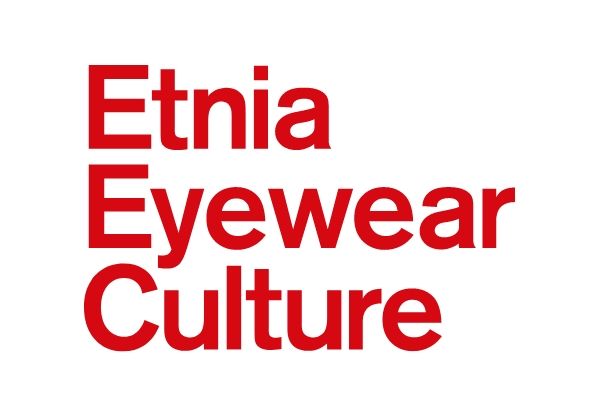 Red eyeglasses on top of a sheet with eyeglass sketches and measurements
