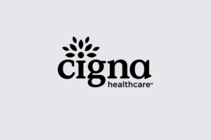Cigna Healthcare logo in black on a light gray background