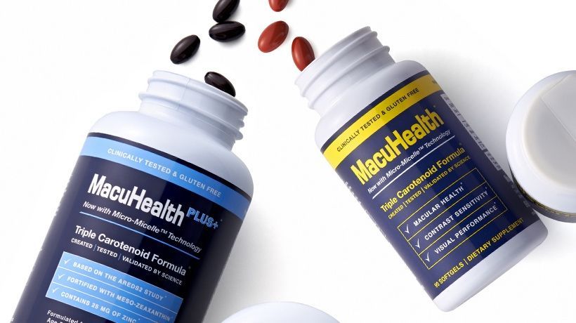 Two MacuHealth supplement bottles on a white background with capsules spilling out