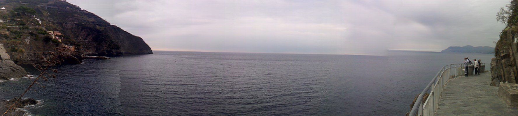 A quiet walk along the coast, where the sea meets the sky and time slows to a gentle pause.
