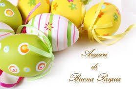Colorful decorated Easter eggs with the Italian greeting 