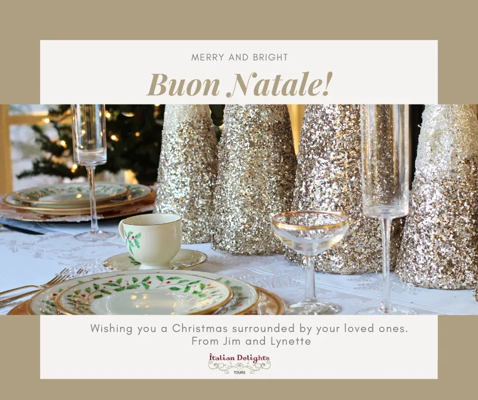 Holiday table setting with holly-patterned china, crystal glasses, and glittering gold cone decorations -- Buon Natale!