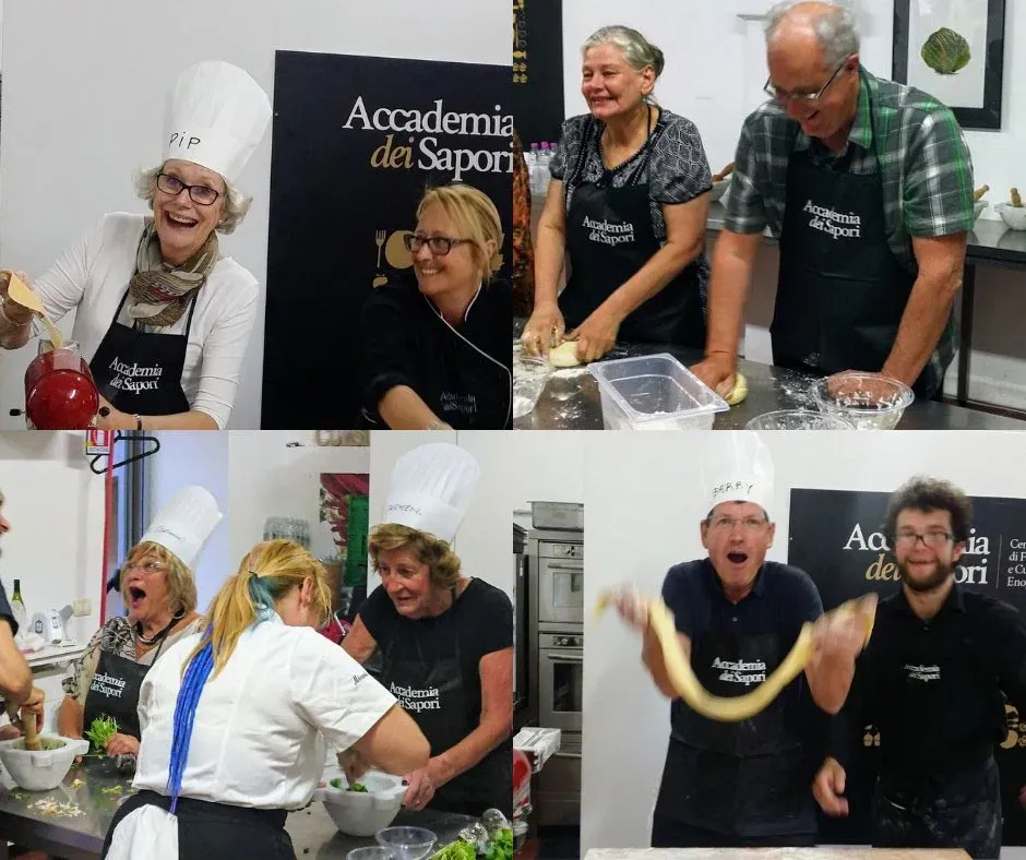 Guests making pasta and sauces at Accademia dei Sapori cooking class in Italy.