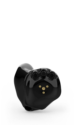 Black in-ear hearing aid device, glossy finish with three small microphone holes and gold contacts on the face.
