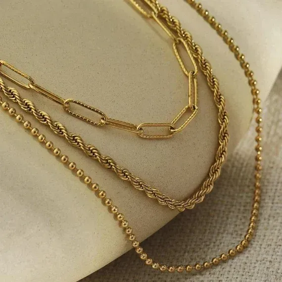 Silver chain with a lobster clasp and loop.