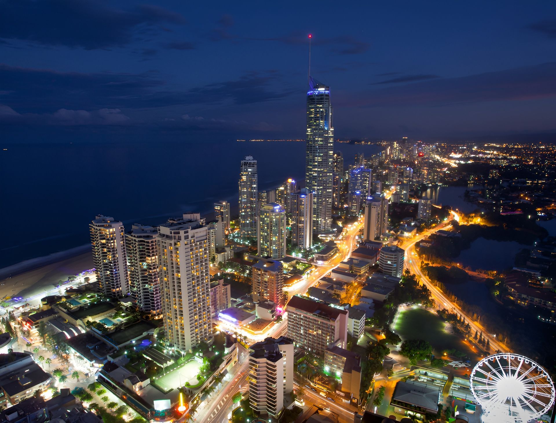 Nighttime Aerial View of a Brightly Lit Coastal City — Slack-Smith Partners In Gold Coast, QLD