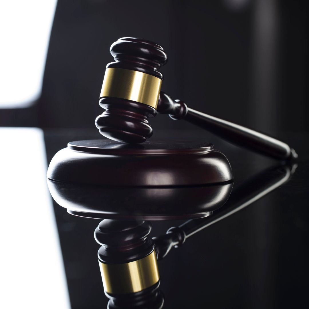 A Wooden Judge's Gavel Is Sitting on A Black Table — Slack-Smith Partners in Tamworth, NSW 