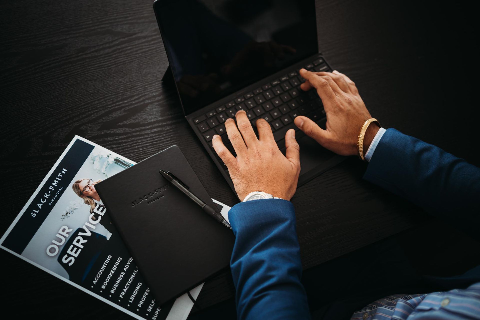 Person in Blue Suit Typing on a Laptop — Slack-Smith Partners in Tamworth, NSW