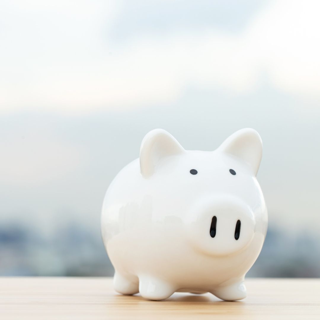 White Piggy Bank on A Wooden Surface — Slack-Smith Partners in Tamworth, NSW
