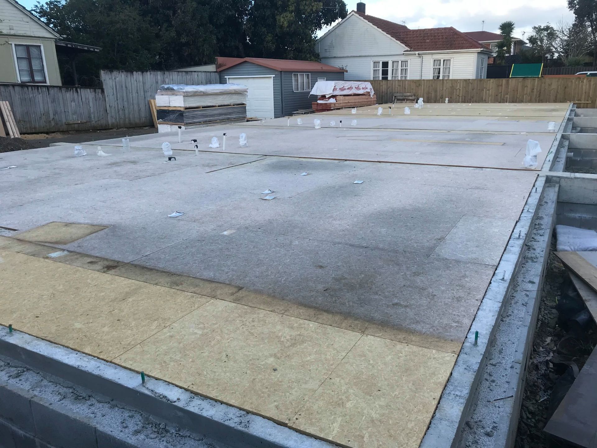 Concrete foundation slab with wood framing, construction site setting. Concrete foundation slab with wood framing, construction site setting.