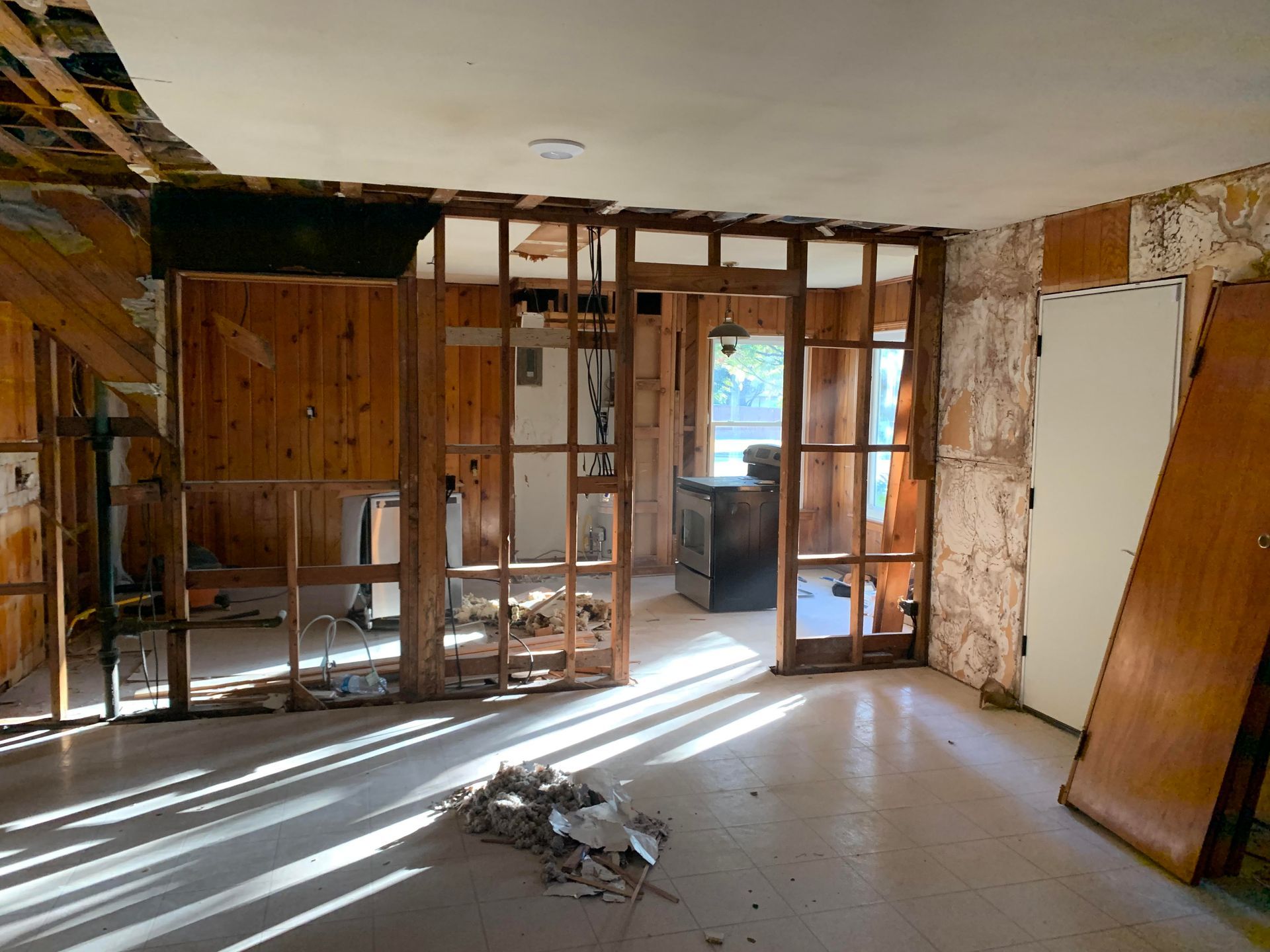 A room that is being remodeled with wooden walls and sliding glass doors