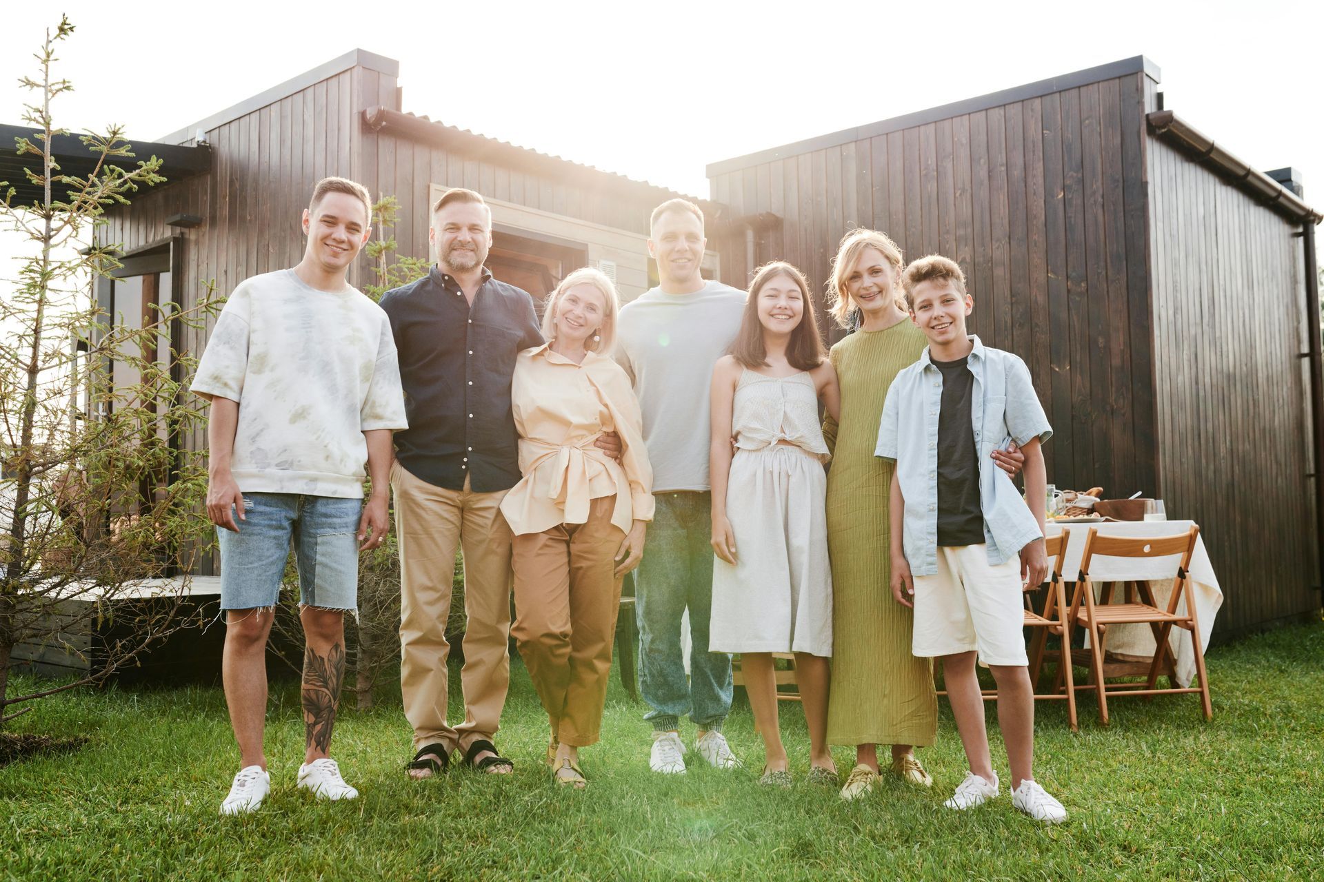 A Family In front of a house standing on the grass — Murphy Finance Solutions In Zuccoli, NT