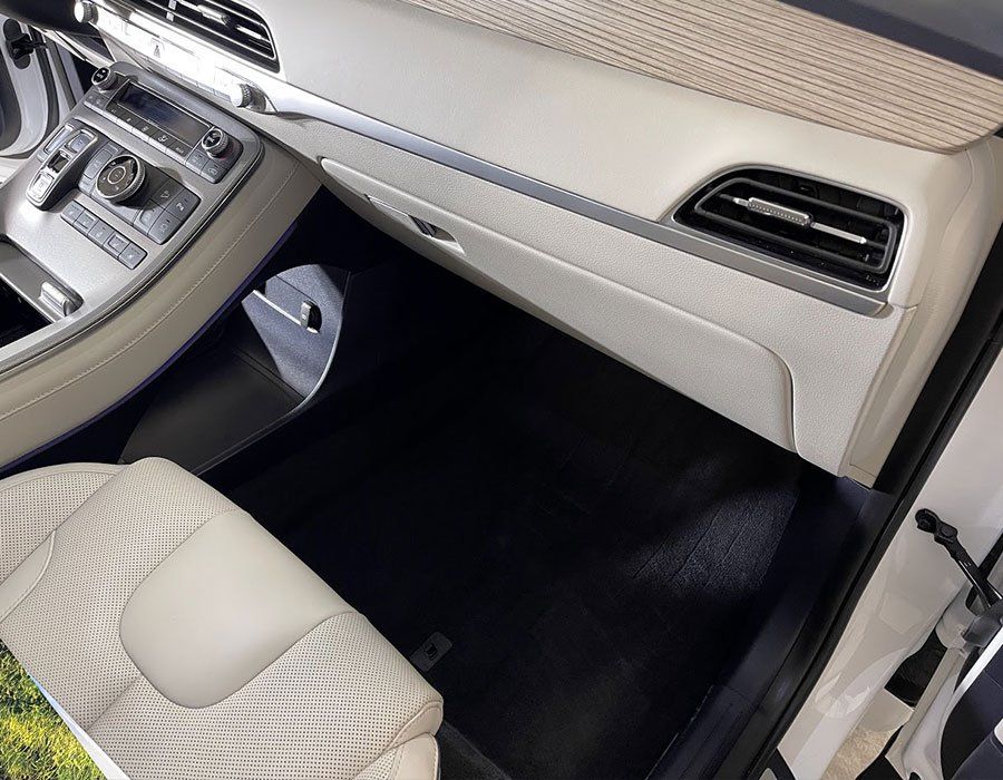 The interior of a car with the door open