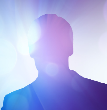 Silhouetted person against bright purple-blue lens flare background