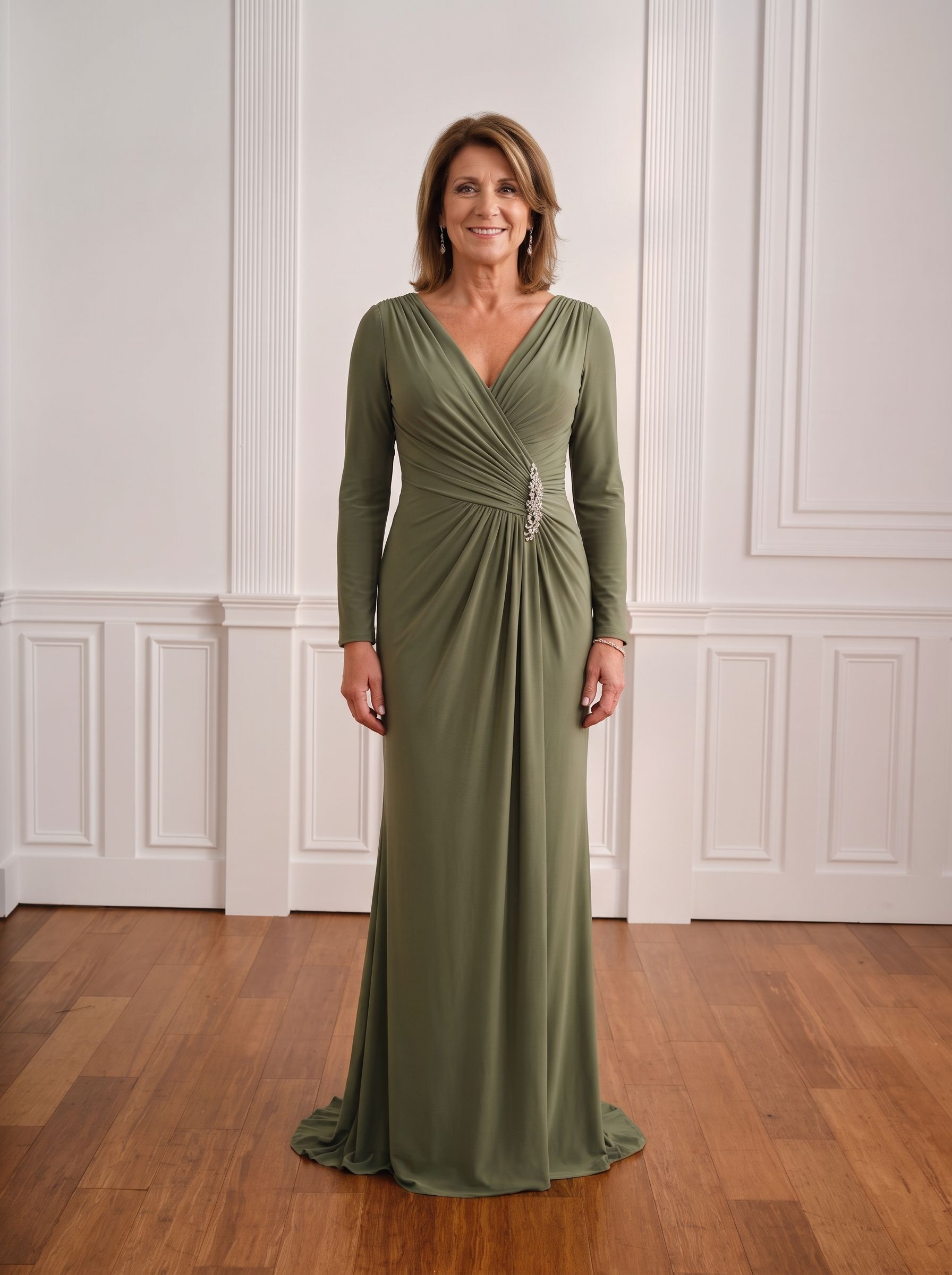 Woman in a black dress standing against a white paneled wall
