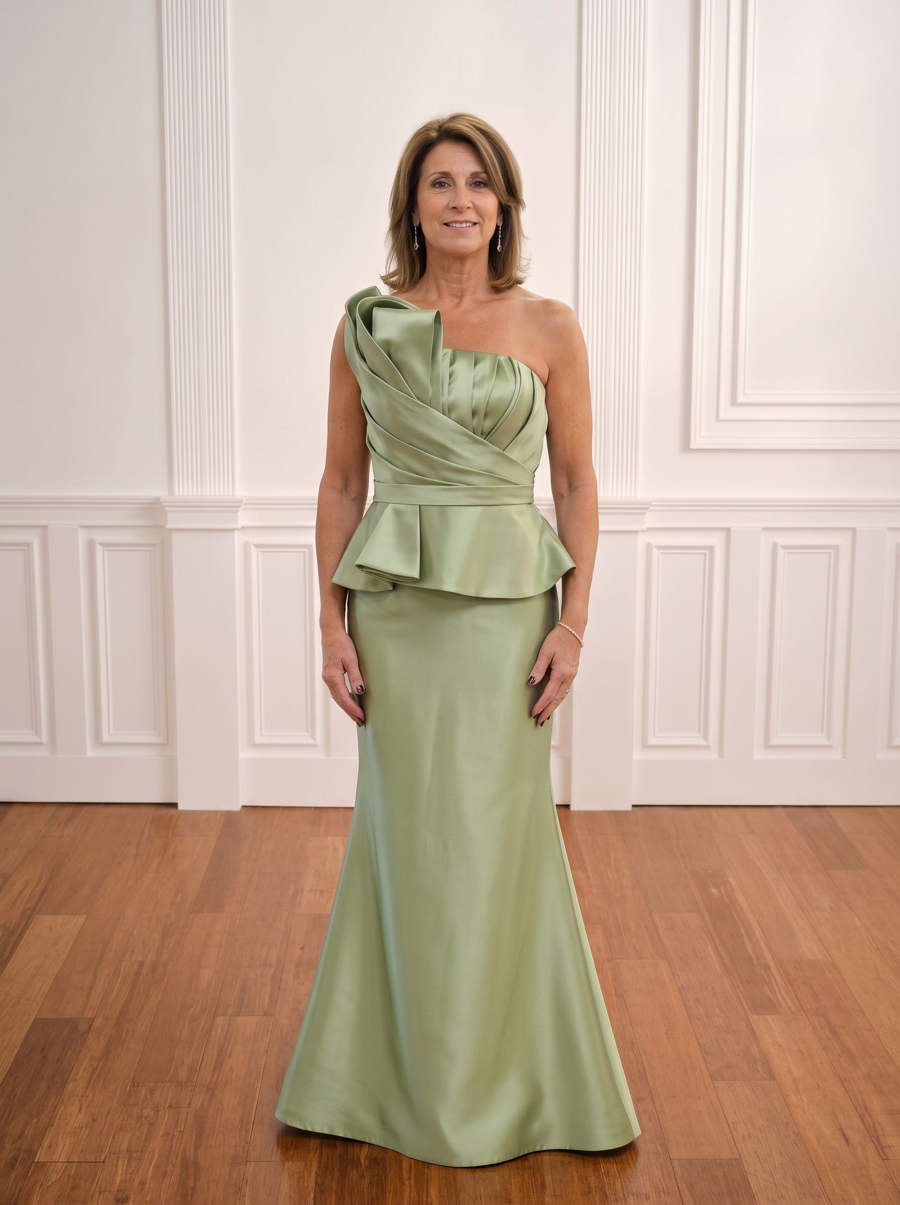 Woman in a navy one-shoulder gown standing in a white-paneled room with wood floors.
