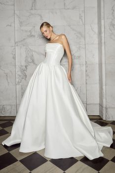 A beautiful designer wedding gown on display in an Elmhurst bridal shop.