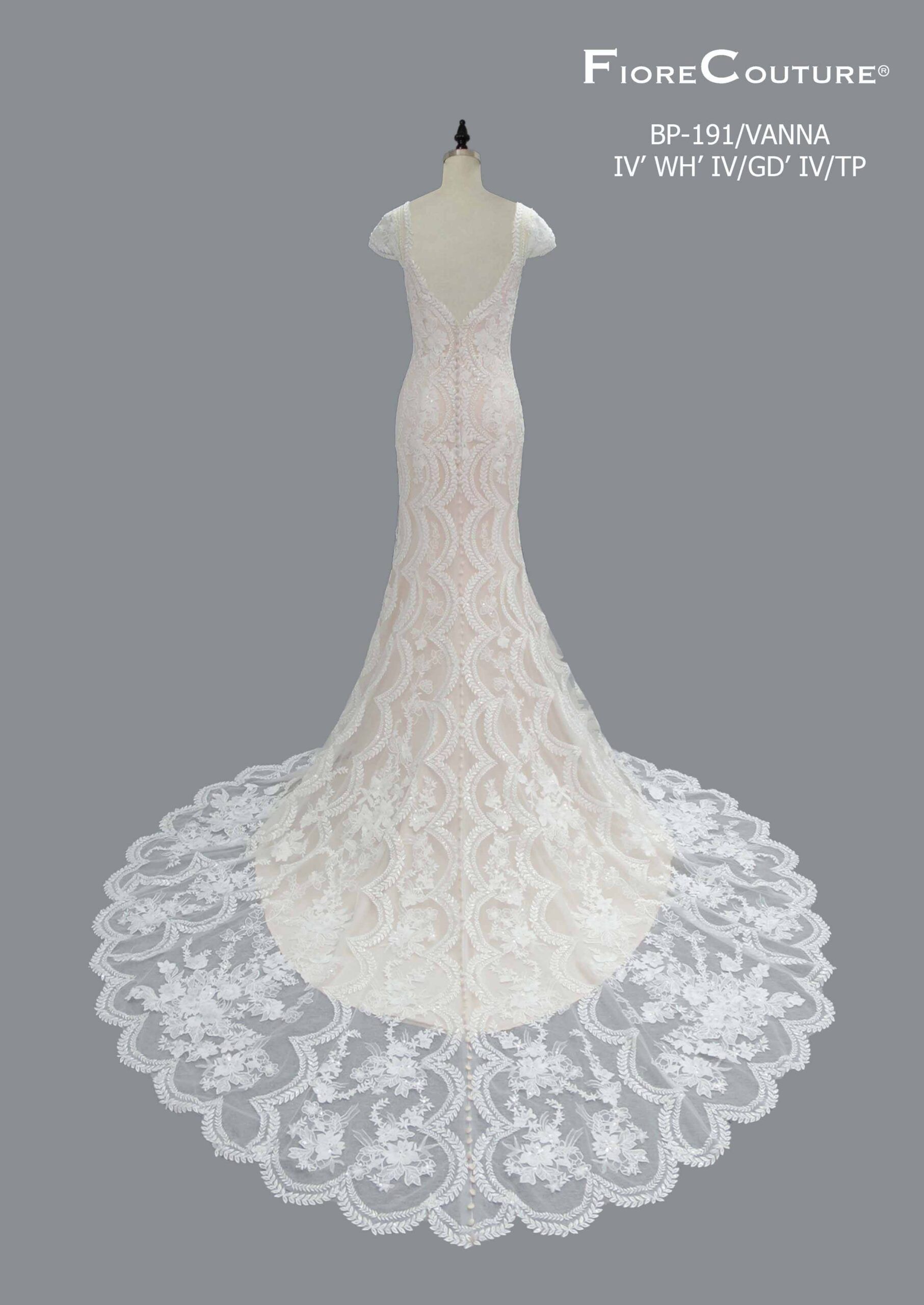 Wedding gown on a mannequin, long train with floral lace, ivory color.